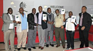 Education academics seen with their new book titled Leadership that Works in Deprived School Contexts of South Africa.