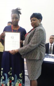 PhD student, Ms Thulebona Shawe is awarded a certificate of recognition from NAAAS.