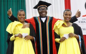 Twins Wanele and Anele Ngcobo graduate from UKZN with Postgraduate Certificates in Education. They are seen with DVC College of Humanities Professor Nhlanhla Mkhize